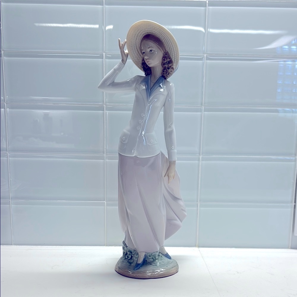 Lladro porcelain figurine titled "Breezy Afternoon”